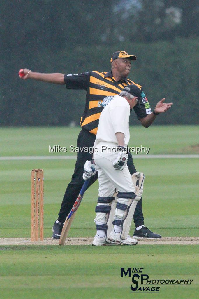 20170627-0899.jpg - Courtney Walsh Bowling with Richard Graham MP in bat at Lashings All Stars vs House Of Commons & Lords, 26th June 2017 Grenfell Tower Fundraising Cricket Event at Latymer Upper School Playing Fields, London.