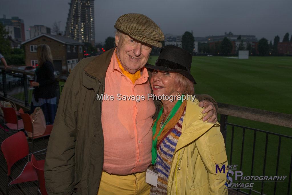 20170627-0963.jpg - Commentator Henry Blofeld and Valeria Blofeld at Lashings All Stars vs House Of Commons & Lords, 26th June 2017 Grenfell Tower Fundraising Cricket Event at Latymer Upper School Playing Fields, London.